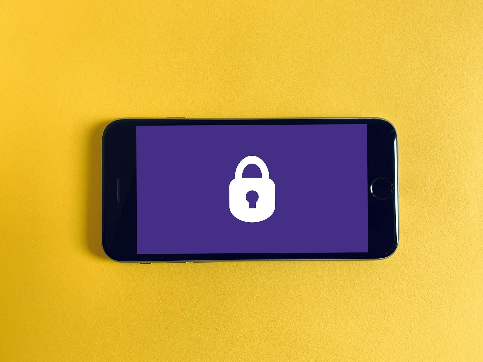 Smartphone with a lock screen on yellow fabric